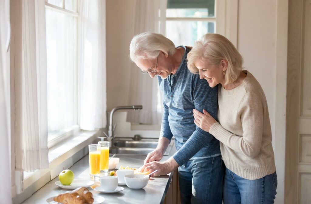 An older couple preparing a quick snack in their kitchen
